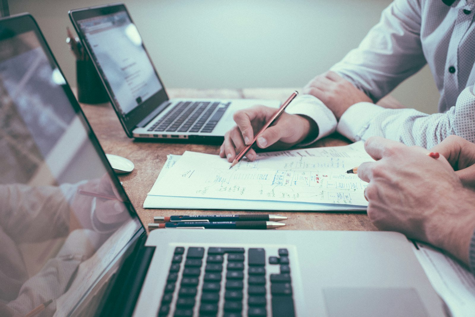 Professionals reviewing employer compliance documents